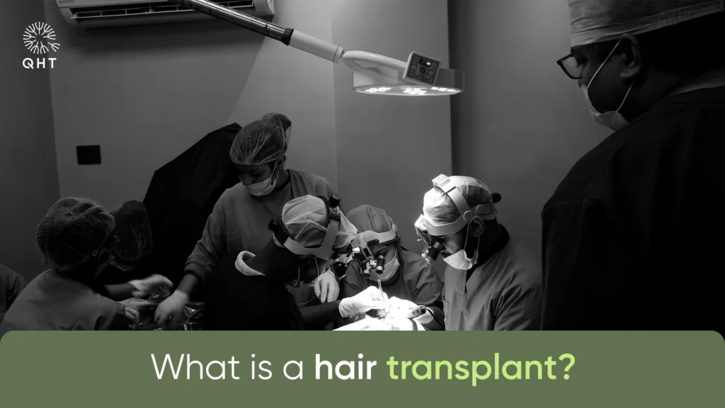 A specialized surgical team at QHT Clinic performing a hair restoration procedure using 10x magnification.
